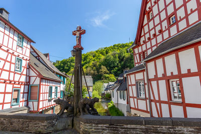 View from an old bridge on river elz and half-timbered houses in monreal, eifel, germany