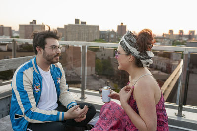 Friends sitting together on a rooftop