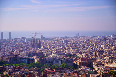 High angle view of city buildings against sky