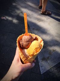 Low section of person holding ice cream
