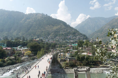 High angle view of buildings and mountains against sky