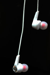 Close-up of light bulb against black background