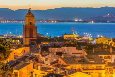 High angle view of townscape by sea