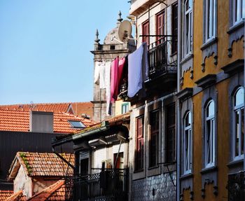 Low angle view of buildings against clear sky