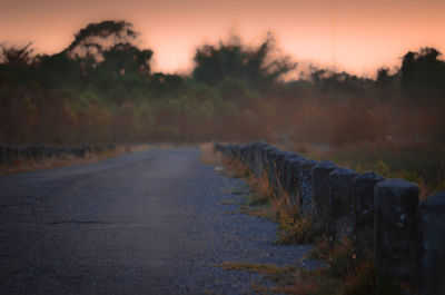 Scenic view of road against sky during sunset