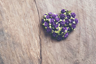 High angle view of purple flowering plants on wooden table