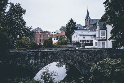 River by cathedral against clear sky