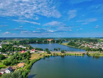 High angle view of river amidst buildings against sky