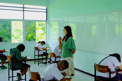 People standing by window