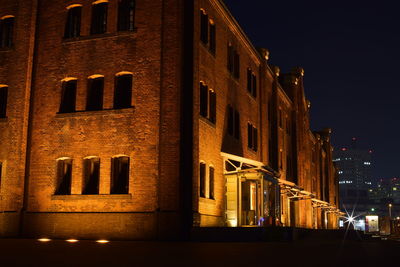 Buildings in city at night