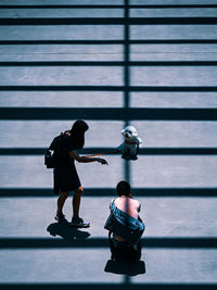 High angle view of boy standing on steps