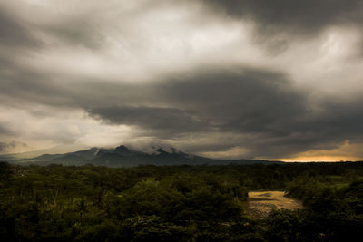 Scenic view of landscape against cloudy sky