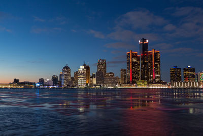 Illuminated city at waterfront