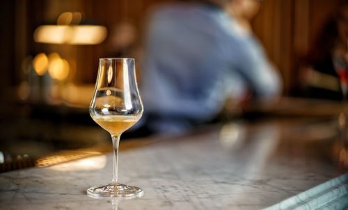 Glass of wine on table in restaurant