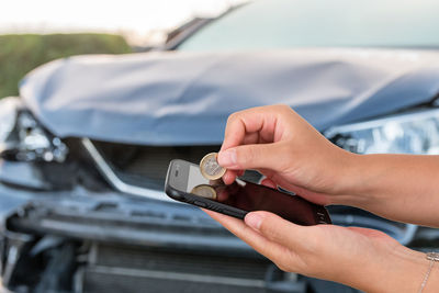 Close-up of hand holding smart phone
