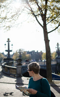 Portrait of woman with maps in amsterdam 