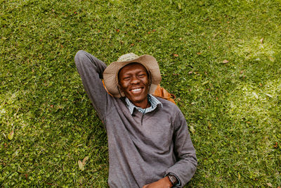 Portrait of smiling young man on field
