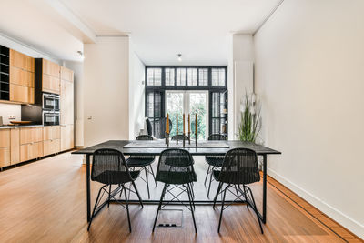 Empty chairs and tables on floor at home