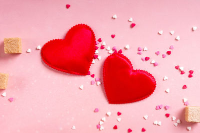 High angle view of heart shape against pink background