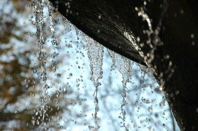 Low angle view of frozen water during winter