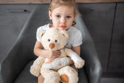 Portrait of cute boy with stuffed toy