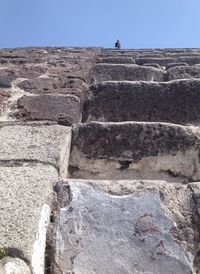 Stone wall against clear sky