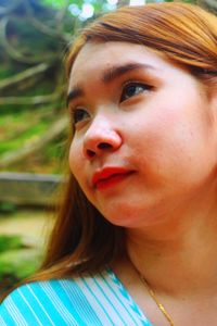 Close-up portrait of a serious young woman