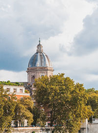 View of temple building against cloudy sky