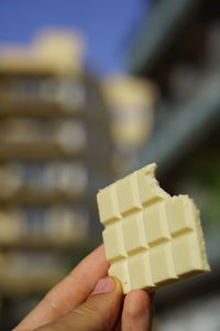 Close-up of hand holding ice cream