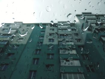 Full frame shot of wet glass window in rainy season