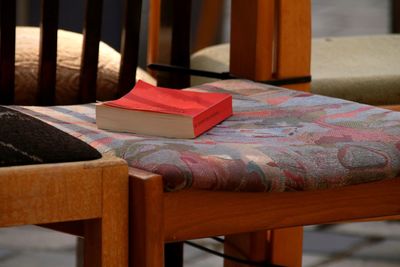 Close-up of book on chair