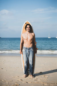 Portrait of man standing on beach