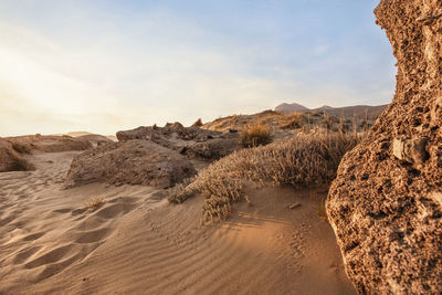 Rock formations in desert against sky