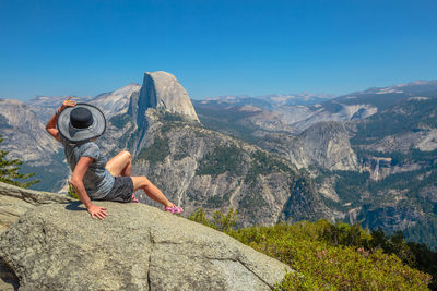 Full length of man on rock against sky