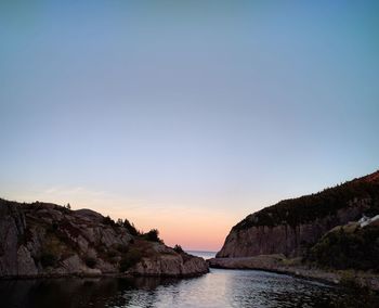 Scenic view of sea against clear sky during sunset