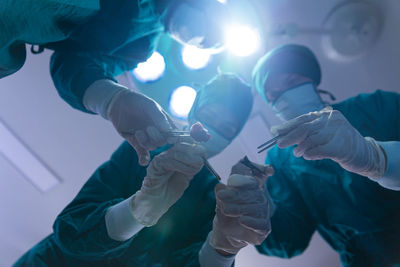 Low angle view of people holding hands