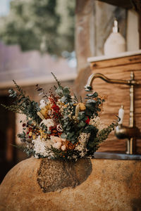Close-up of flower vase on table