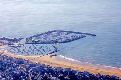 High angle view of sea and cityscape