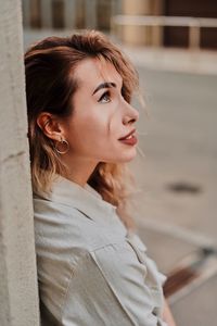 Portrait of young woman looking away