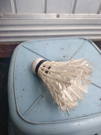 High angle view of white container on table