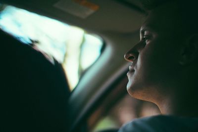 Close-up of man in car