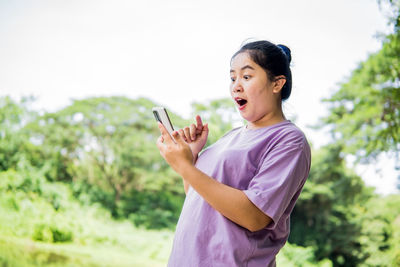 Young woman using mobile phone