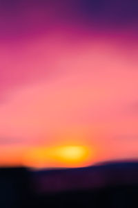 Defocused image of pink sky at sunset
