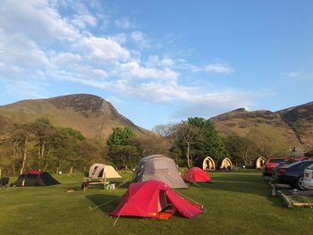 Tent on field against sky