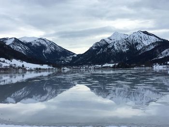 Scenic view of snowcapped mountains against sky