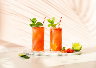 Summer refreshing cocktails made of strawberries, lime, mint.