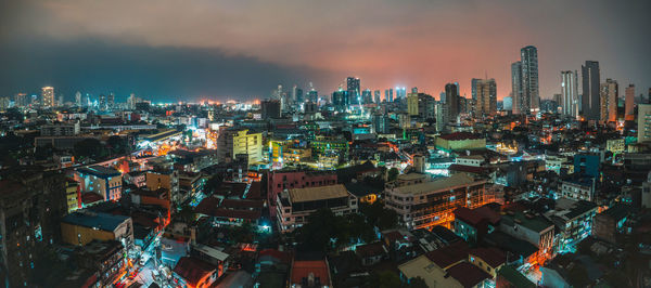 High angle view of illuminated buildings in city against sky