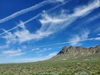 Scenic view of landscape against blue sky