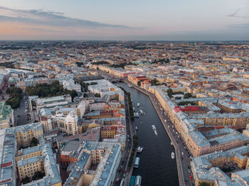 Sunset aerial view on fontanka river and old houses in center of st petersburg. colorful rooftops.