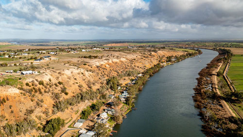 High angle view of river amidst landscape against sky